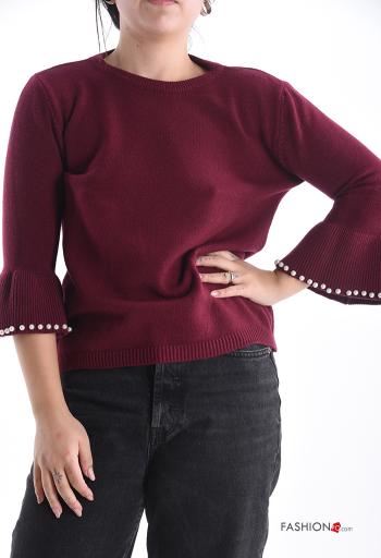 Pull col rond avec des perles manches à trois-quarts