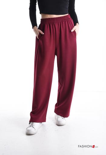 Pantalone sportivo a zampa con tasche con elastico - ph 1