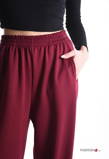 Pantalone sportivo a zampa con tasche con elastico - ph 4