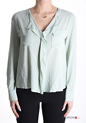 Blusa con tasche scollo a V