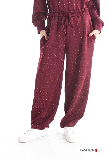 Pantalones con bolsillos con brillantes con cinturón
