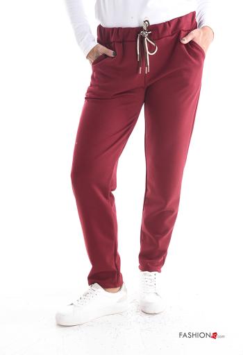 Pantalones con cinturón con bolsillos