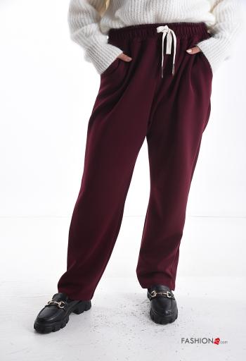 Trousers with pockets with elastic